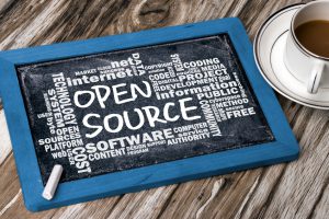 open source handwritten with related word cloud on blackboard